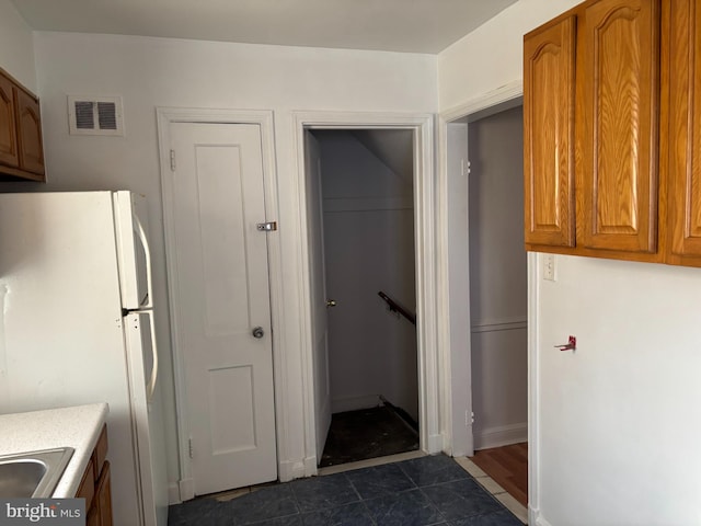 kitchen featuring white refrigerator