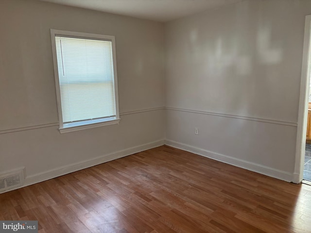 empty room featuring hardwood / wood-style flooring