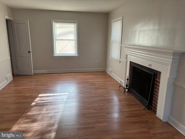 unfurnished living room with hardwood / wood-style flooring