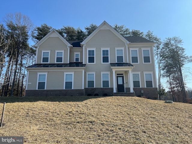 view of front of home featuring a front lawn