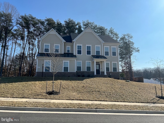 view of front of home featuring a front lawn