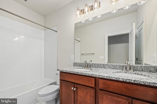 full bathroom with vanity, shower / tub combination, and toilet