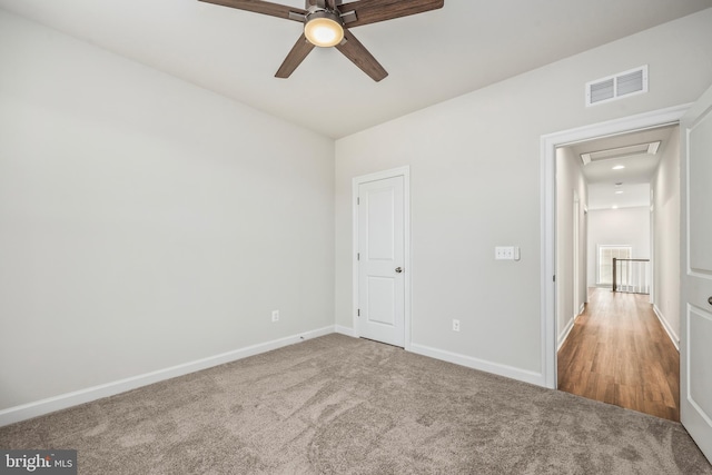 interior space with ceiling fan