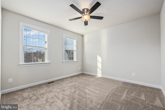 carpeted empty room with ceiling fan