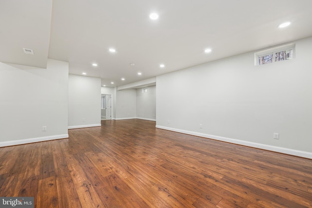 basement featuring dark hardwood / wood-style floors