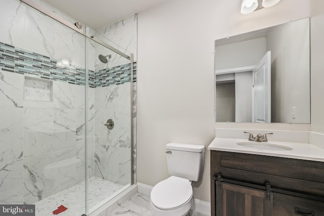 bathroom featuring walk in shower, vanity, and toilet