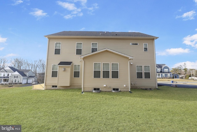 rear view of house featuring a yard and central AC