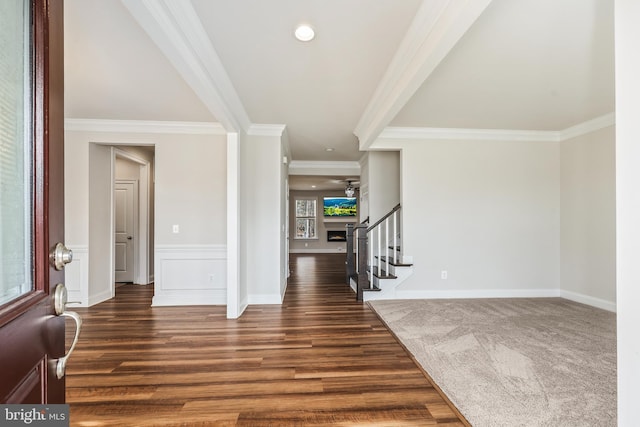 entryway featuring dark wood-type flooring and ornamental molding