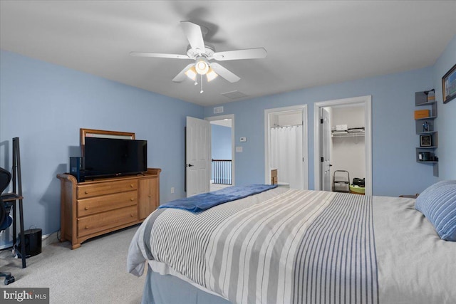 bedroom featuring ceiling fan, a closet, visible vents, and carpet flooring