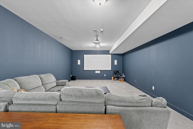 carpeted cinema with baseboards