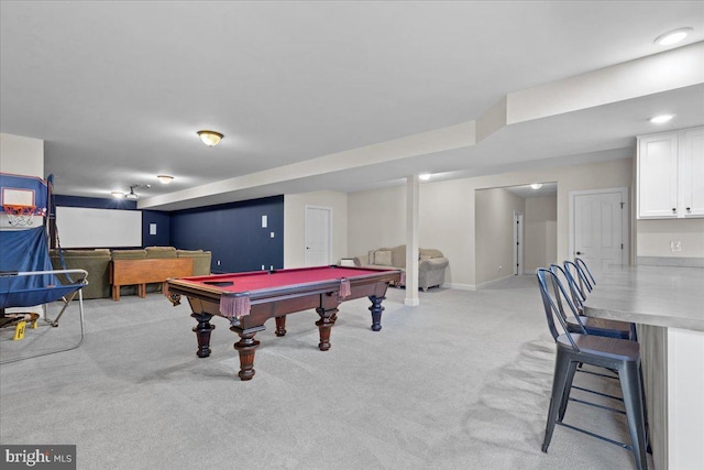 game room with light carpet, pool table, and baseboards