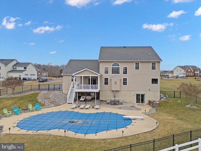 view of swimming pool with a yard, a patio area, a deck, a fenced backyard, and stairs