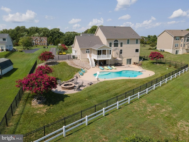 back of house featuring a fire pit, a fenced backyard, stairway, a deck, and a patio area