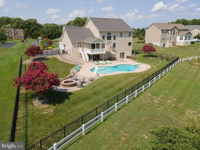 view of pool featuring a patio, stairway, a deck, a fenced backyard, and a fire pit