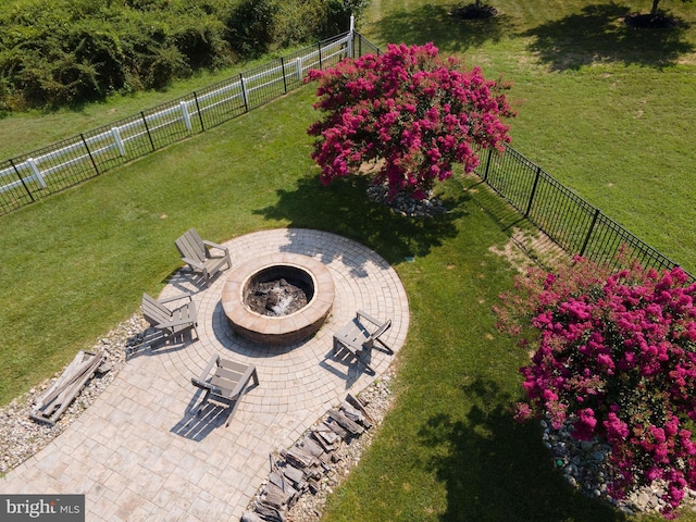 view of yard with an outdoor fire pit, a patio area, and a fenced backyard