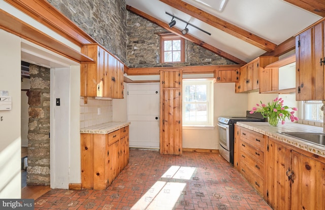 kitchen featuring tasteful backsplash, stainless steel electric range oven, sink, and lofted ceiling with beams