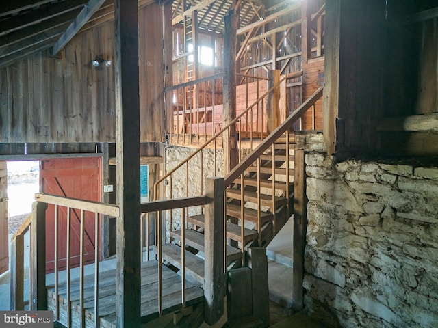 staircase with vaulted ceiling