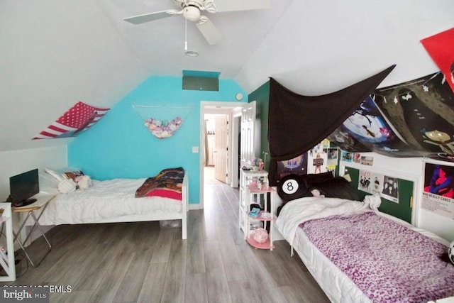 bedroom featuring lofted ceiling, wood-type flooring, and ceiling fan