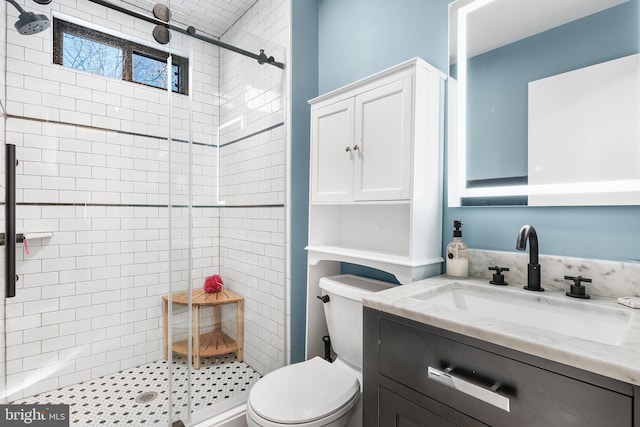 bathroom featuring vanity, toilet, and walk in shower