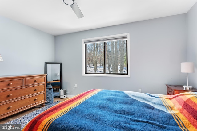 bedroom featuring hardwood / wood-style floors and ceiling fan