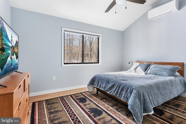 bedroom with ceiling fan, dark wood-type flooring, vaulted ceiling, and a wall mounted AC