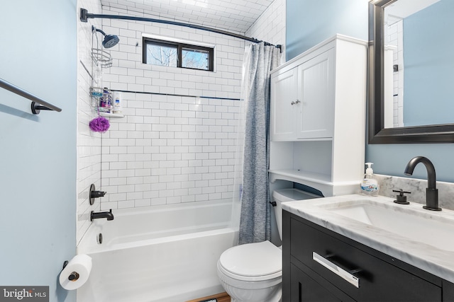 full bathroom with vanity, shower / tub combo with curtain, and toilet