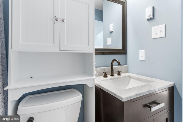 bathroom with vanity and toilet