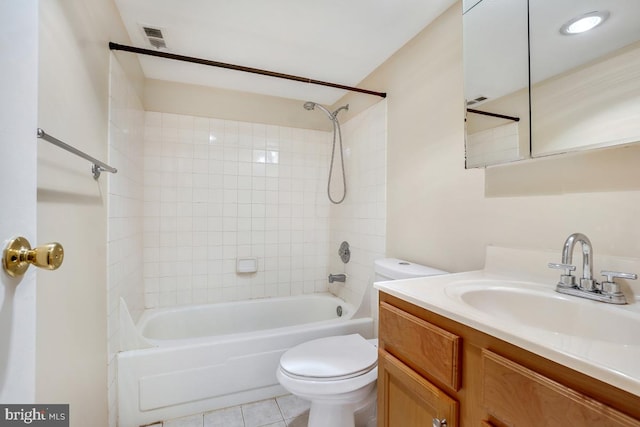 bathroom featuring shower / bath combination, visible vents, toilet, vanity, and tile patterned floors