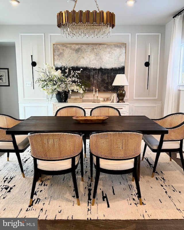 dining space featuring a decorative wall