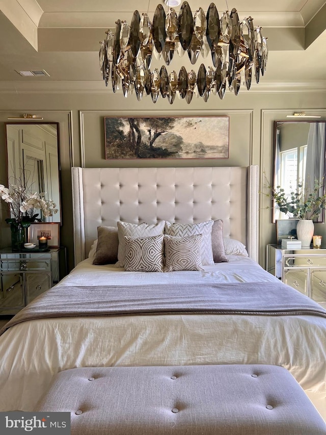 bedroom with ornamental molding