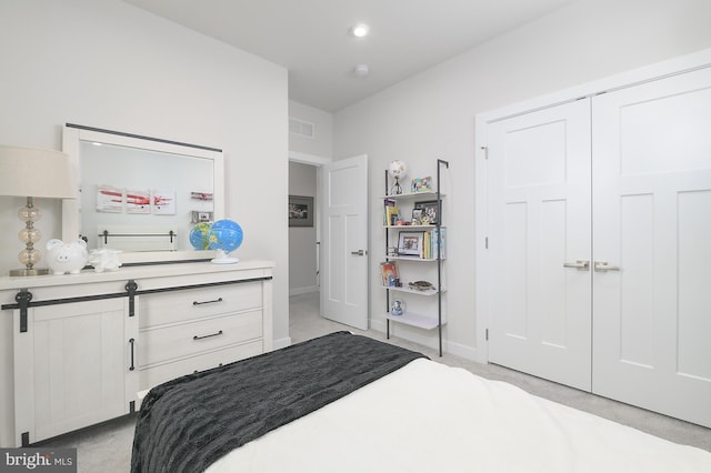 carpeted bedroom featuring a closet