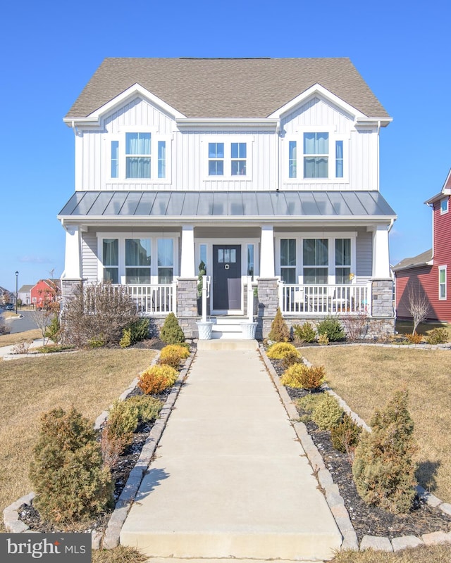 view of front of home featuring a porch and a front lawn