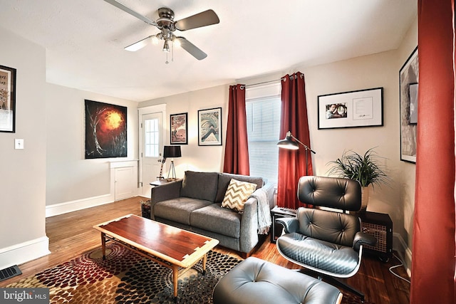 living room featuring ceiling fan and wood-type flooring