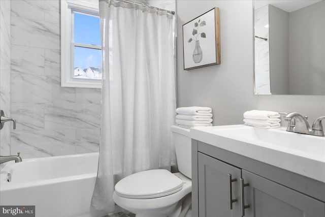 full bathroom with shower / tub combo with curtain, vanity, and toilet