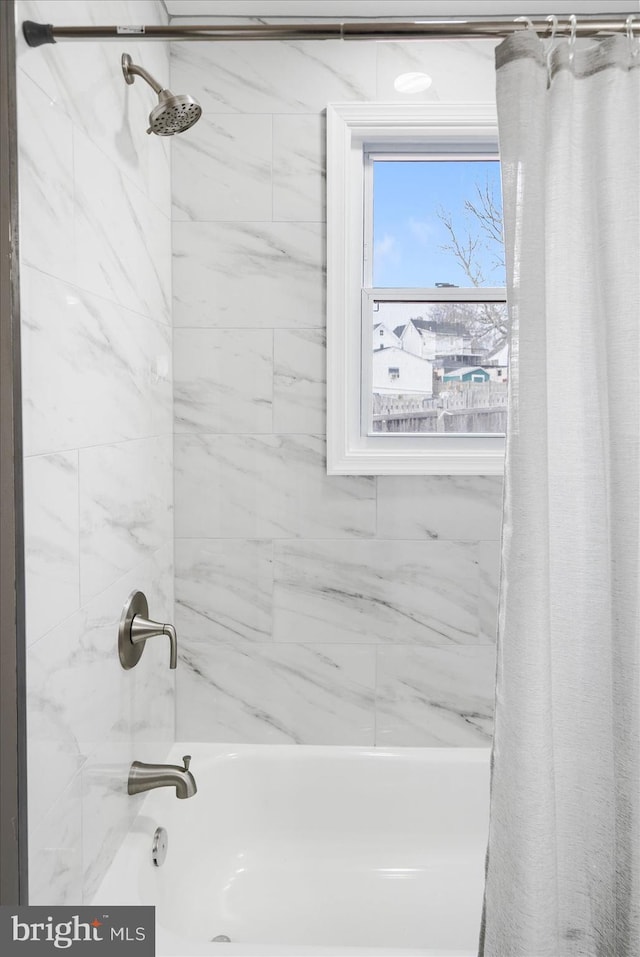 bathroom featuring shower / tub combo