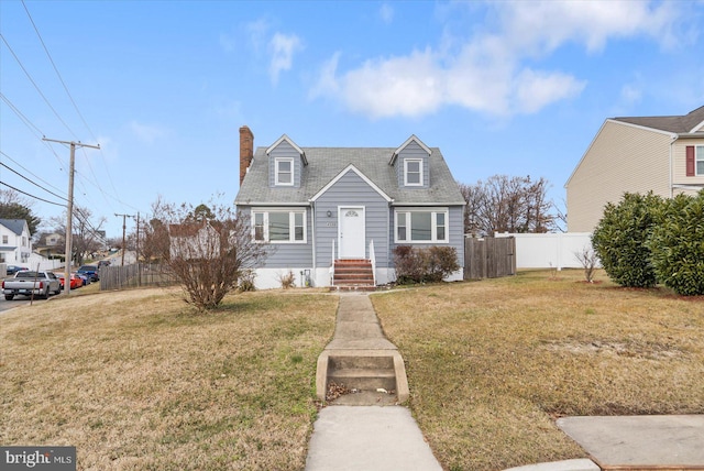 new england style home with a front yard