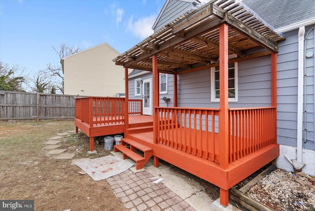 wooden deck featuring a pergola