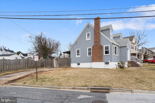 view of property exterior featuring a yard