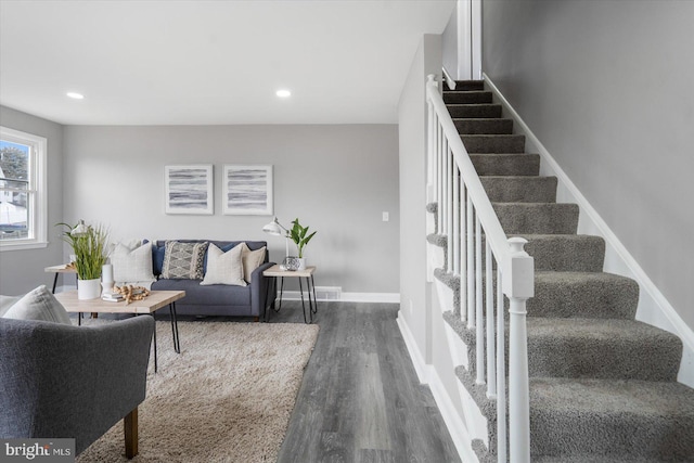 living room featuring dark hardwood / wood-style floors