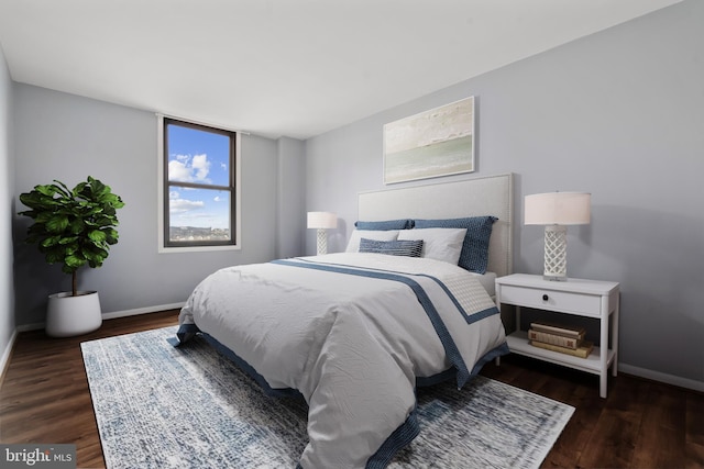 bedroom featuring dark hardwood / wood-style flooring