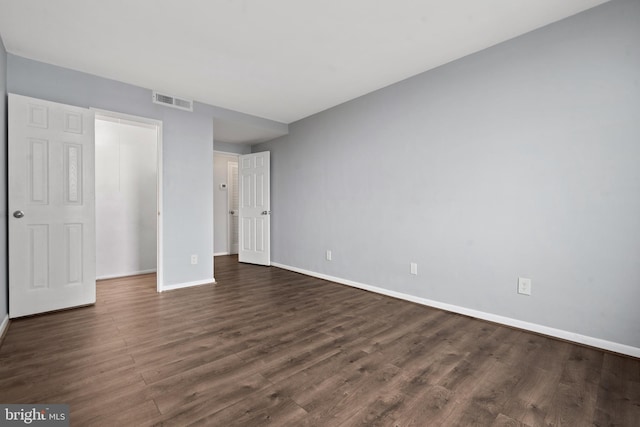 unfurnished bedroom featuring dark wood-type flooring