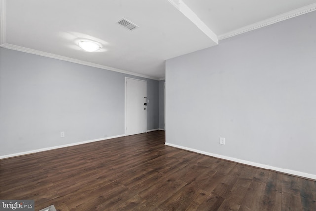 empty room with crown molding and dark hardwood / wood-style flooring