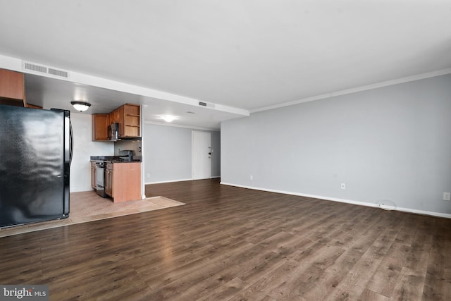 unfurnished living room featuring crown molding and wood-type flooring