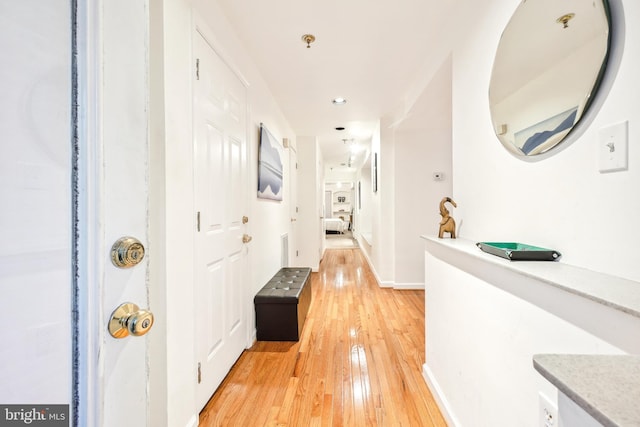 hall with light hardwood / wood-style flooring