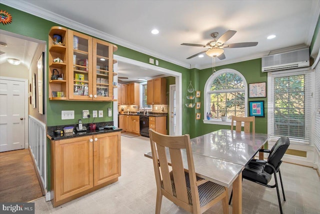 dining area featuring crown molding, ceiling fan, sink, and an AC wall unit