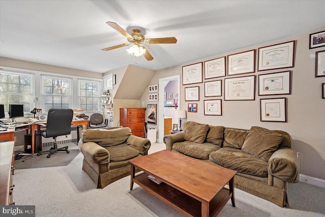 office space featuring radiator, light carpet, and ceiling fan