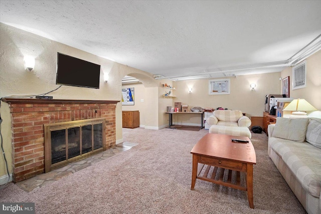 living room with a fireplace, a textured ceiling, and carpet flooring