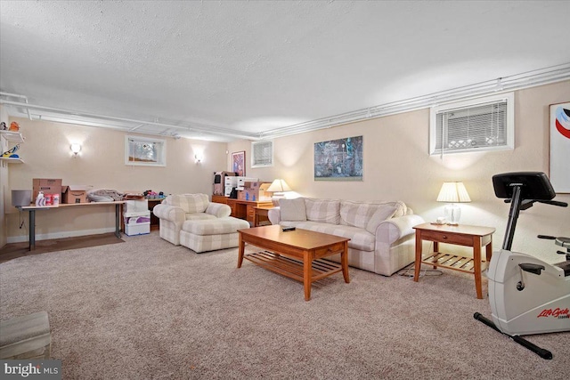 carpeted living room featuring a textured ceiling