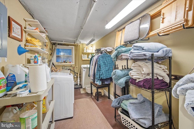 clothes washing area featuring independent washer and dryer