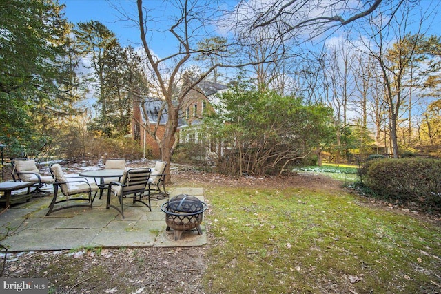 view of yard featuring a fire pit and a patio area